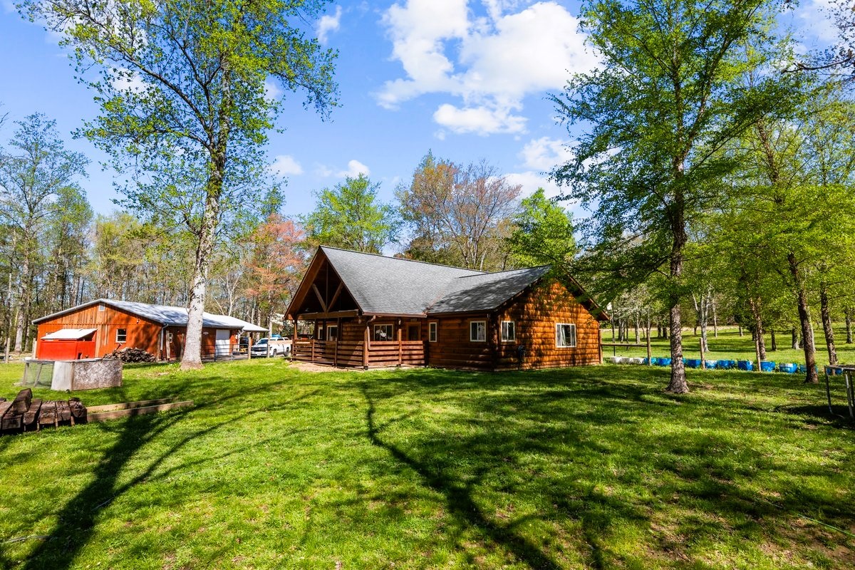 13631 Birdsong Road Holladay, TN 38341 - Photo 4 of 67 a view of a house with a big yard