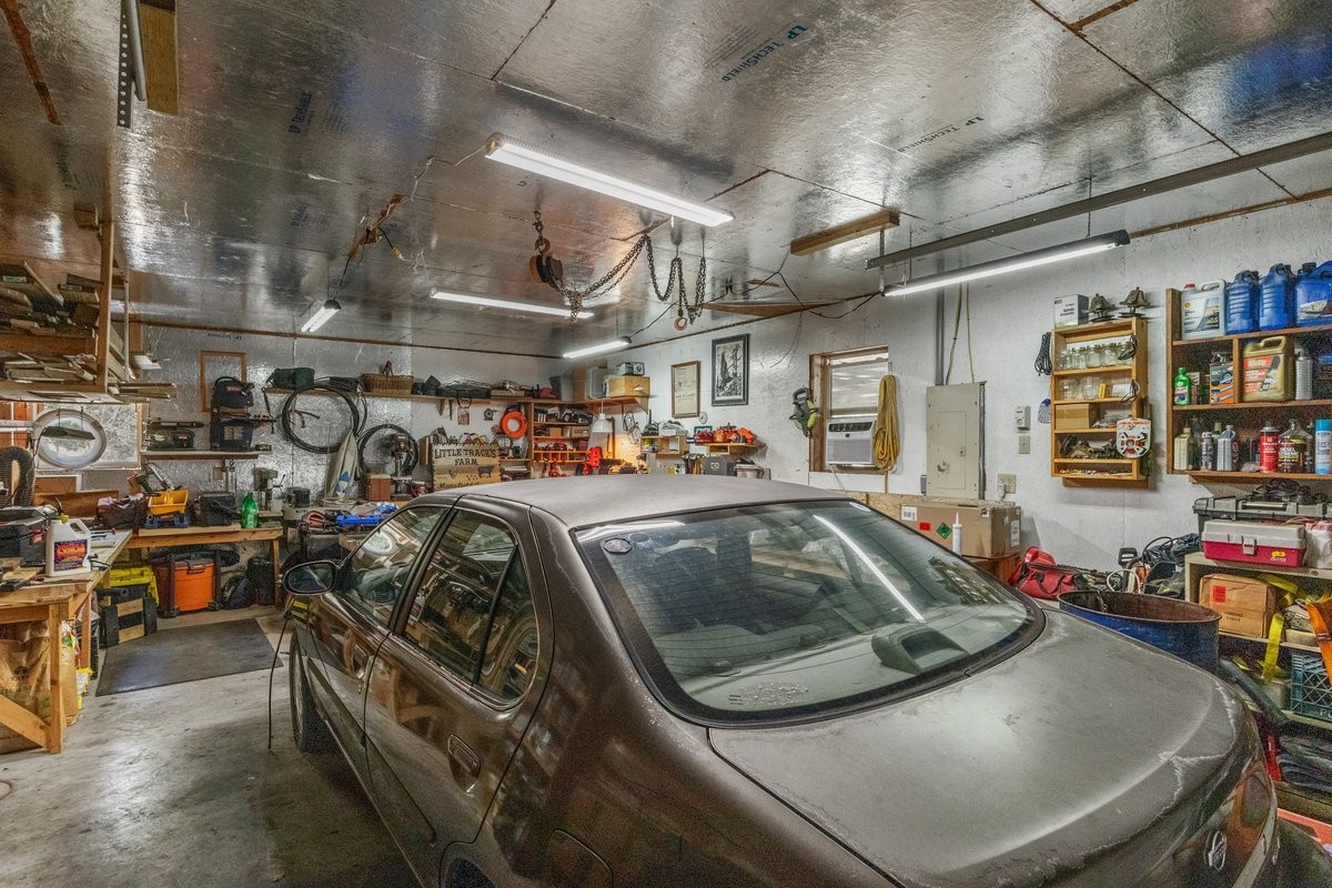 13631 Birdsong Road Holladay, TN 38341 - Photo 43 of 67 a view of parking garage with cars