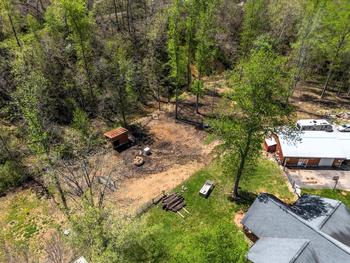 13631 Birdsong Road Holladay, TN 38341 - Photo 50 of 67 a backyard of a house with lots of green space