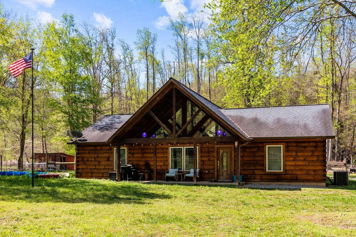 13631 Birdsong Road Holladay, TN 38341 - Photo 5 of 67 a front view of a house with a yard