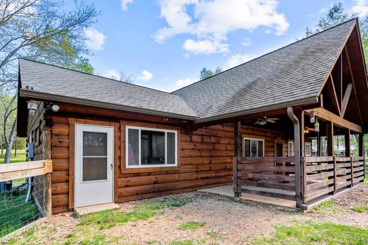 13631 Birdsong Road Holladay, TN 38341 - Photo 6 of 67 a front view of a house with a balcony