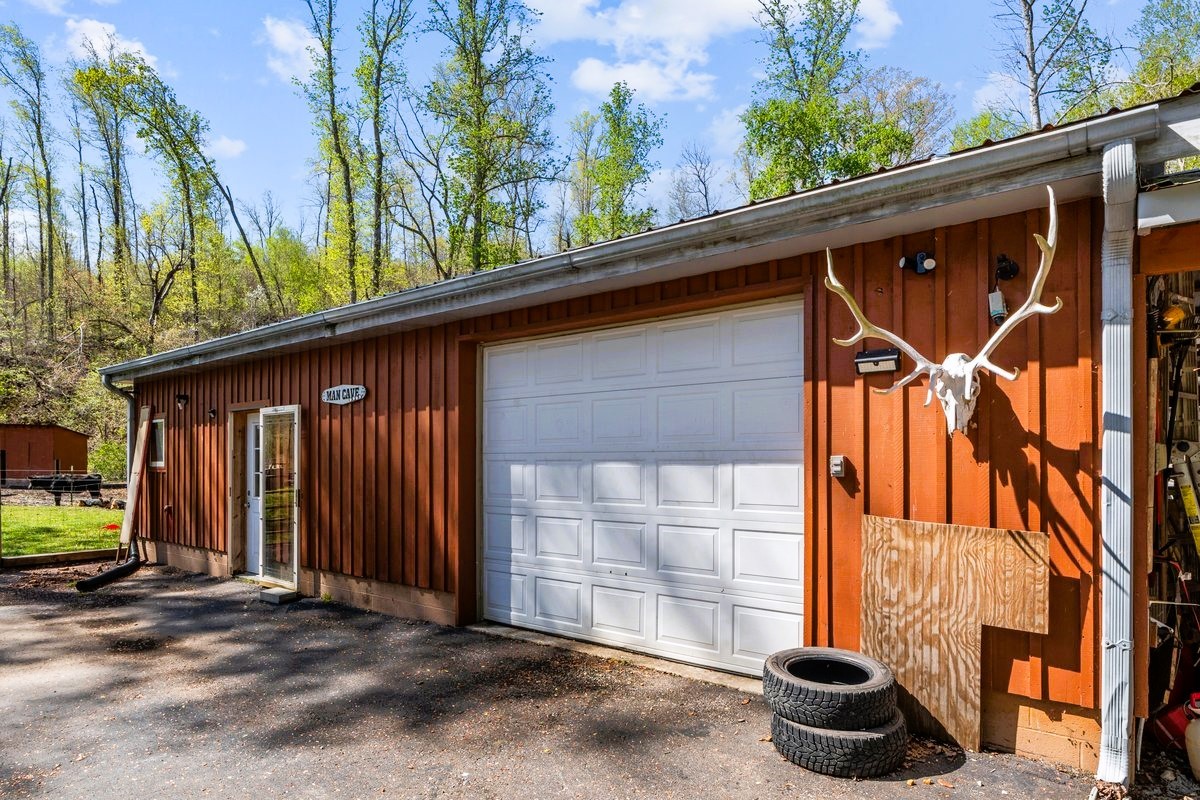 13631 Birdsong Road Holladay, TN 38341 - Photo 8 of 67 a backyard of a house with seating space