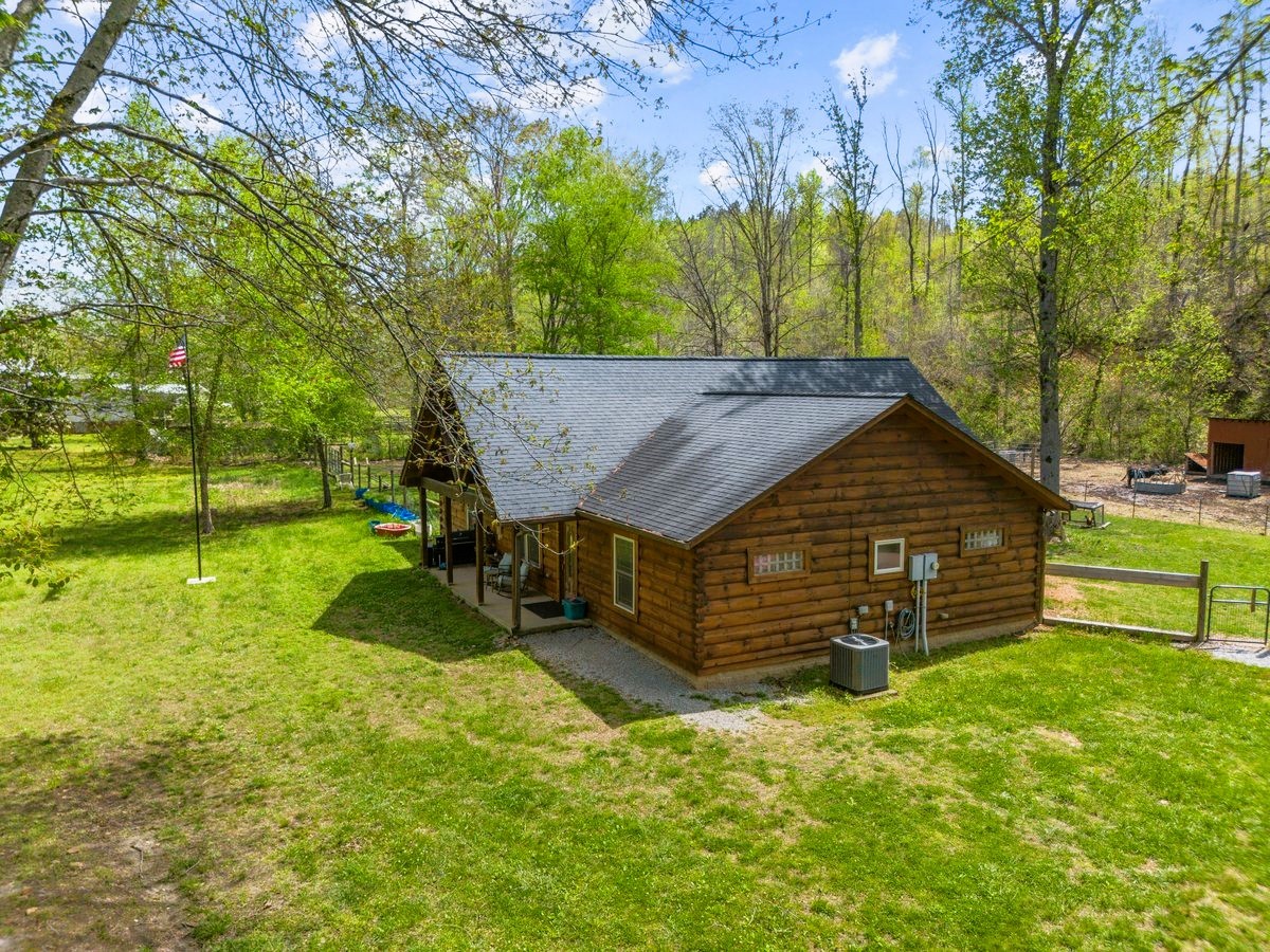 13631 Birdsong Road Holladay, TN 38341 - Photo 9 of 67 front view of a house with a yard