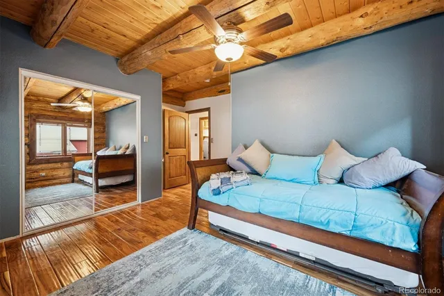 a bedroom with a large bed and a balcony