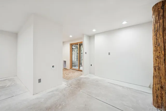 a bathroom with a shower and a sink