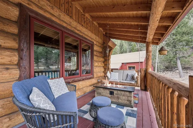a view of a roof deck with wooden floor and fence