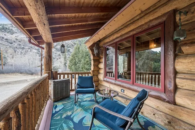 a view of a balcony with chairs