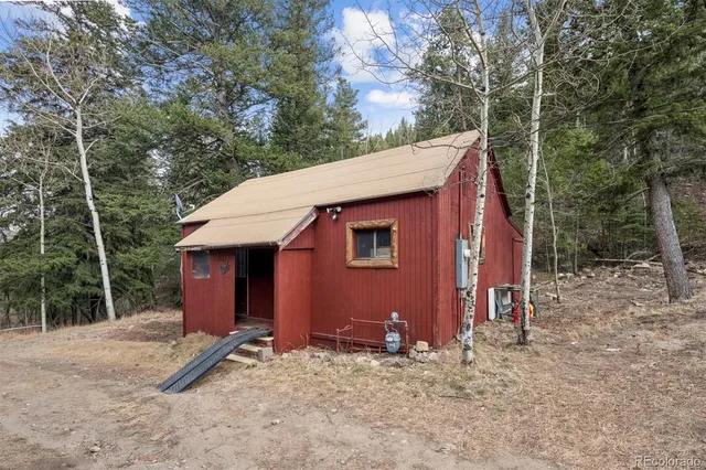 a picture of a bench in front of a wall