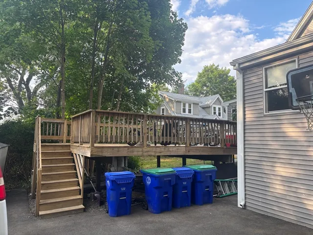a view of a chair and tables in the balcony