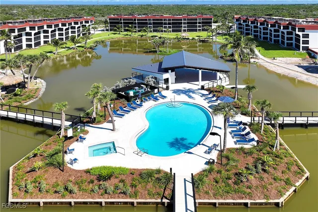 an aerial view of a house with a ocean view