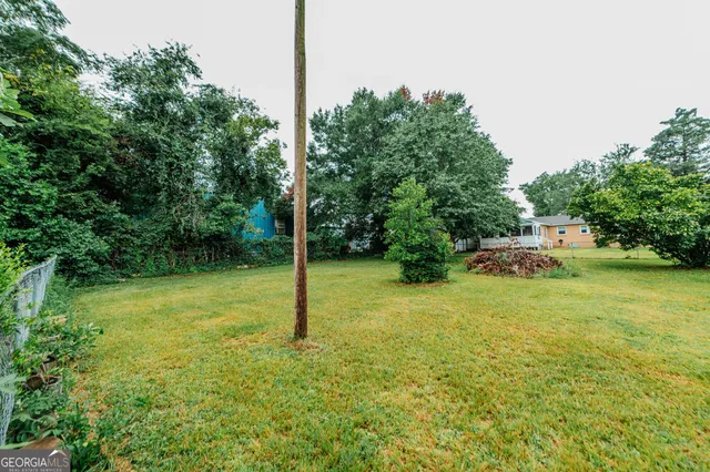 a backyard of a house with lots of green space
