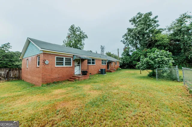a view of a backyard with a small cabin