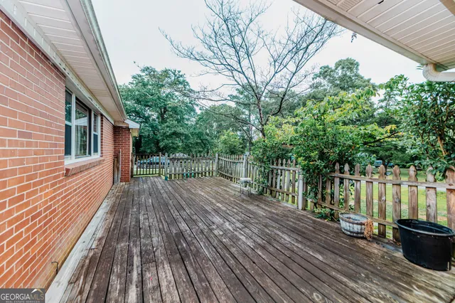 a view of outdoor space with deck and large trees