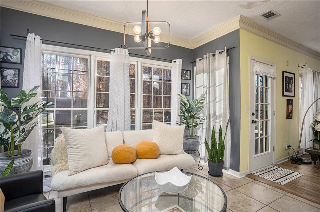 655 Scenic View Stone Mountain, GA 30087 - Photo 19 of 41 a living room with furniture windows and wooden floor
