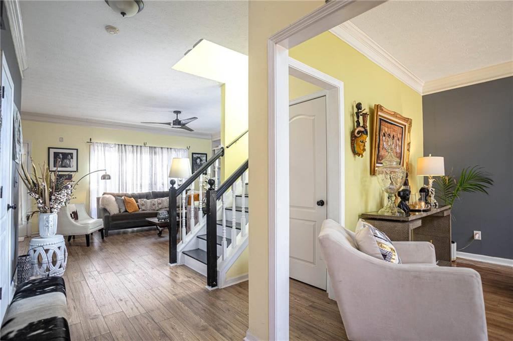 655 Scenic View Stone Mountain, GA 30087 - Photo 2 of 41 a living room with furniture and a wooden floor