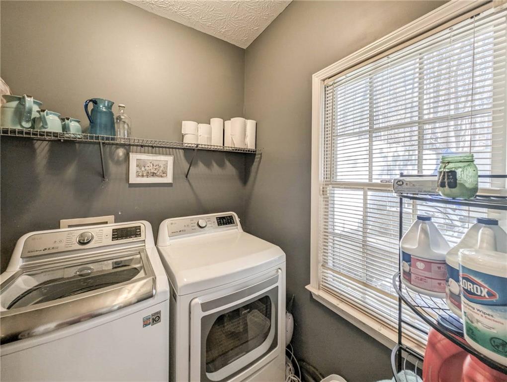 655 Scenic View Stone Mountain, GA 30087 - Photo 21 of 41 a utility room with dryer and washer