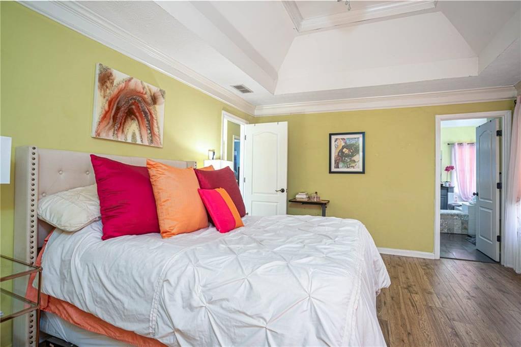 655 Scenic View Stone Mountain, GA 30087 - Photo 26 of 41 a bedroom with a bed and a couch