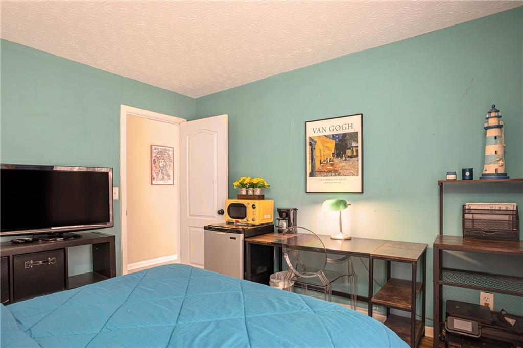655 Scenic View Stone Mountain, GA 30087 - Photo 33 of 41 a living room with furniture and a flat screen tv