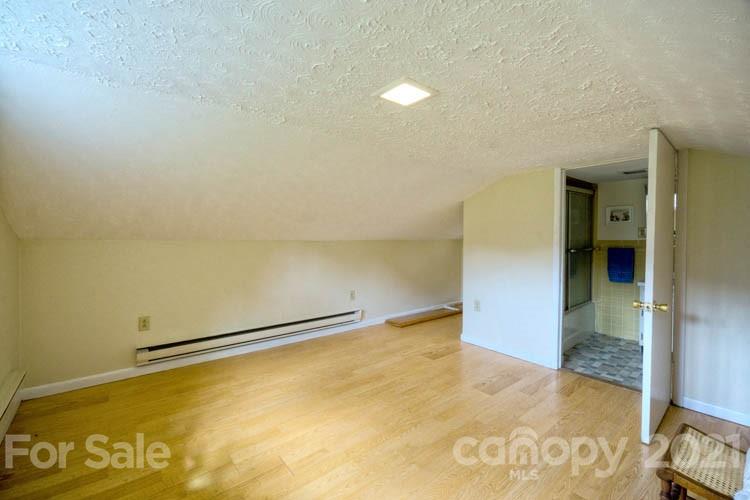4900 Crabtree Mountain Road Clyde, NC 28721 - Photo 15 of 33 an empty room with a door