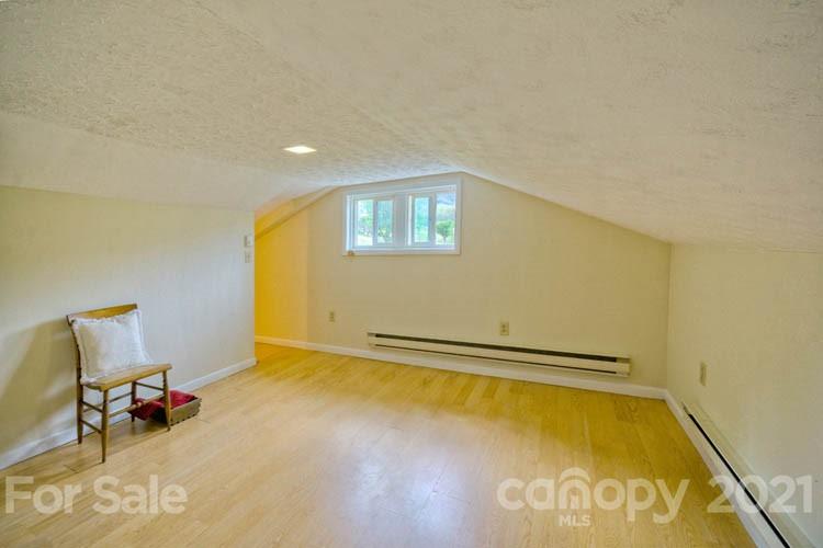 4900 Crabtree Mountain Road Clyde, NC 28721 - Photo 16 of 33 a view of an empty room with a window