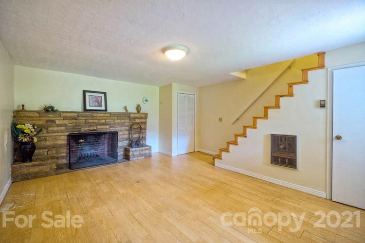 4900 Crabtree Mountain Road Clyde, NC 28721 - Photo 20 of 33 a view of a livingroom with a fireplace