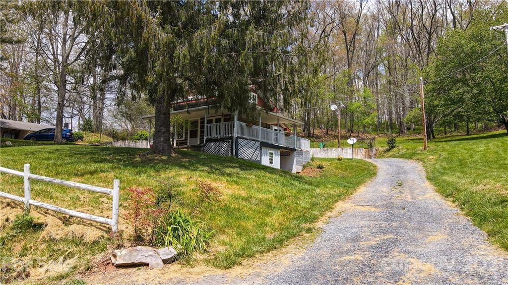 4900 Crabtree Mountain Road Clyde, NC 28721 - Photo 30 of 33 a view of a patio with a yard
