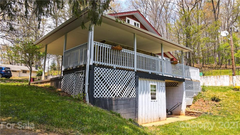 4900 Crabtree Mountain Road Clyde, NC 28721 - Photo 33 of 33 a view of a house with a yard