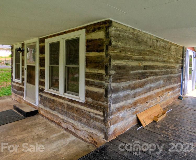 4900 Crabtree Mountain Road Clyde, NC 28721 - Photo 7 of 33 a view of house with wooden floor and windows