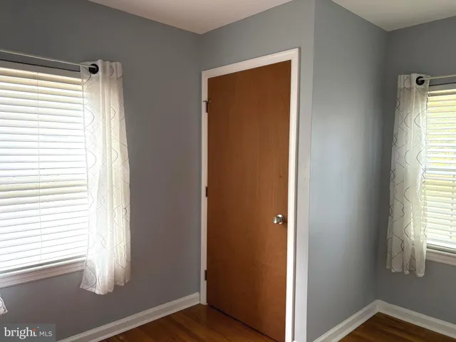 a view of front door with wooden floor