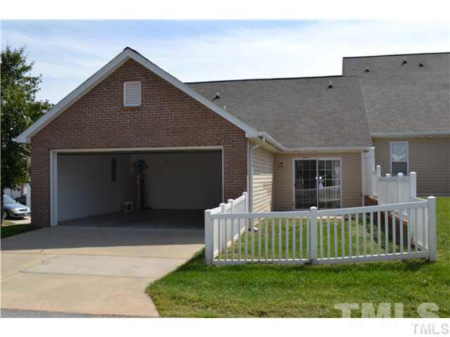 11370 Involute Place, Unit 105 Raleigh, NC 27617 - Photo 11 of 15 a front view of a house with a yard