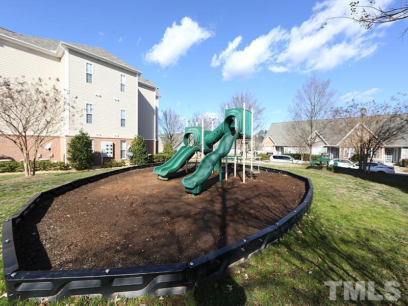 11370 Involute Place, Unit 105 Raleigh, NC 27617 - Photo 14 of 15 a view of a swimming pool with a yard