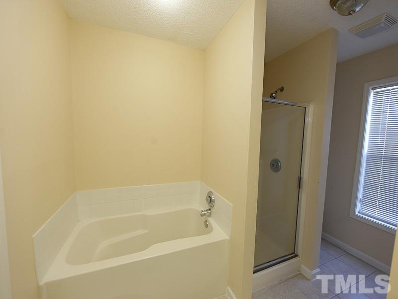 11370 Involute Place, Unit 105 Raleigh, NC 27617 - Photo 6 of 15 a bathroom with a bathtub