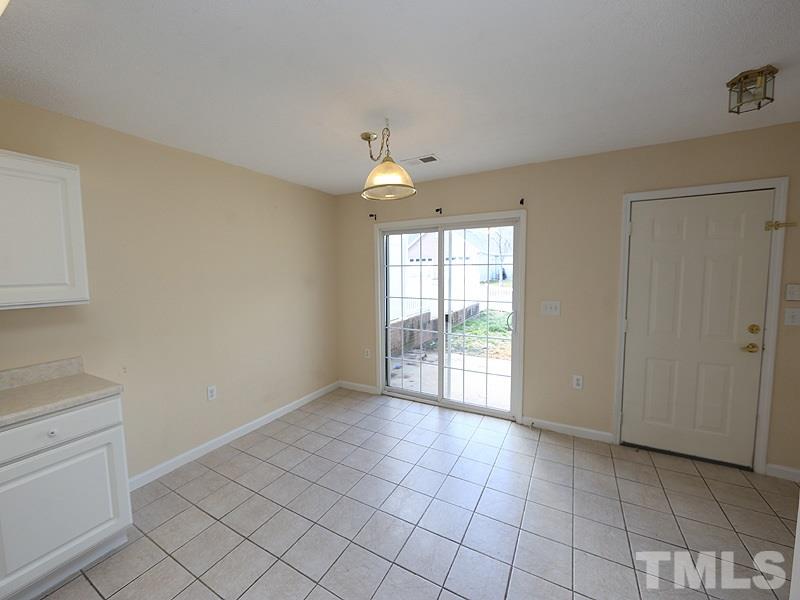 11370 Involute Place, Unit 105 Raleigh, NC 27617 - Photo 8 of 15 a view of an empty room with a window