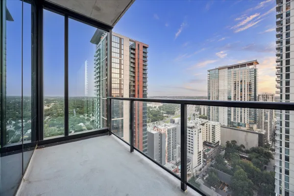 a view of a balcony with city view
