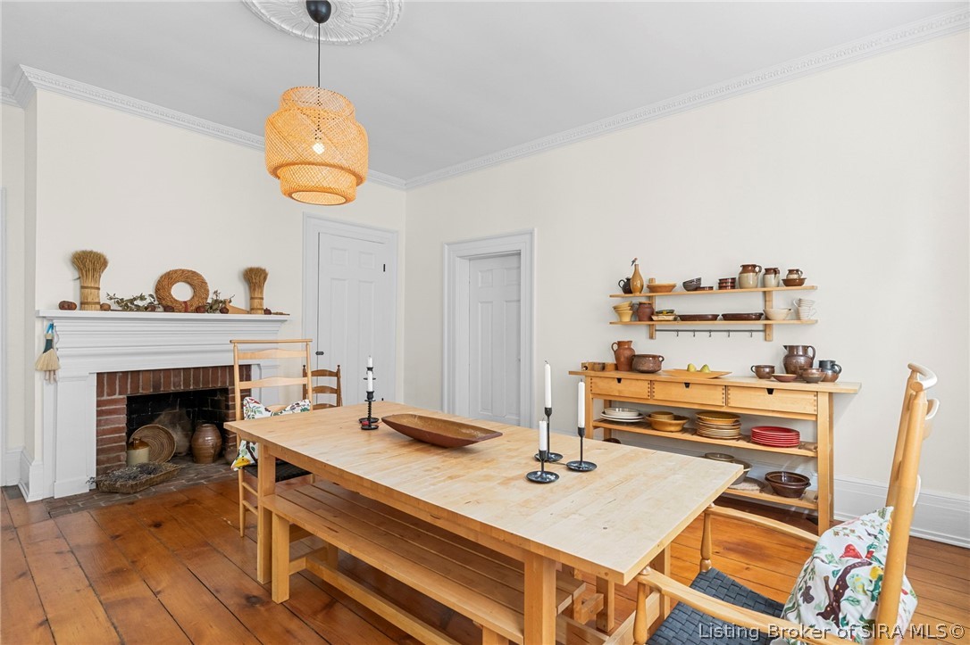 312 West 3rd Street Madison, IN 47250 - Photo 9 of 52 Dining Room with hardwood floors and fireplace