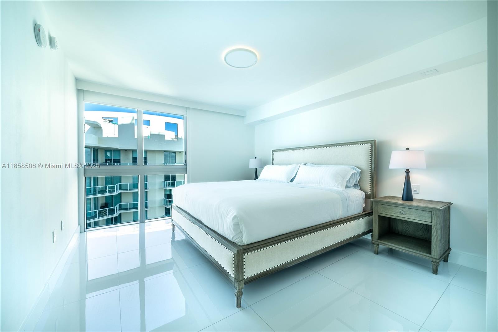 300 Sunny Isles Boulevard, Unit 41901 Sunny Isles Beach, FL 33160 - Photo 15 of 28 a bedroom with a bed and a window