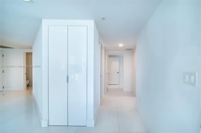 a view of a bathroom from a hallway