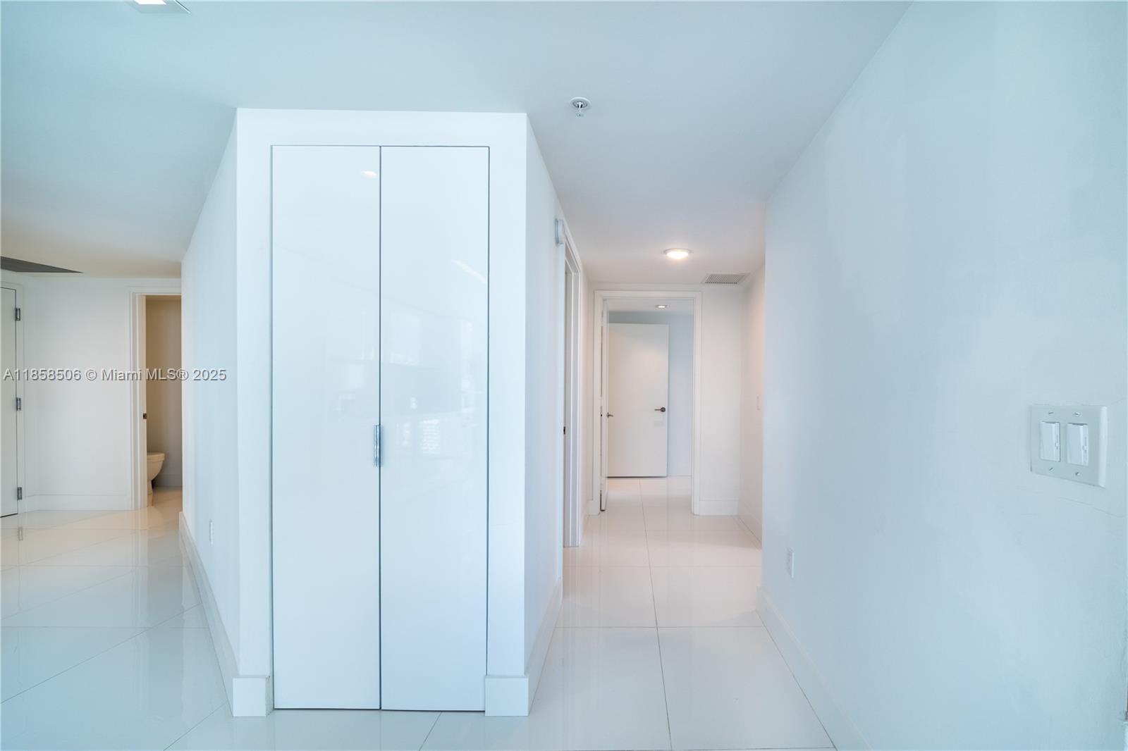 300 Sunny Isles Boulevard, Unit 41901 Sunny Isles Beach, FL 33160 - Photo 22 of 28 a view of a bathroom from a hallway