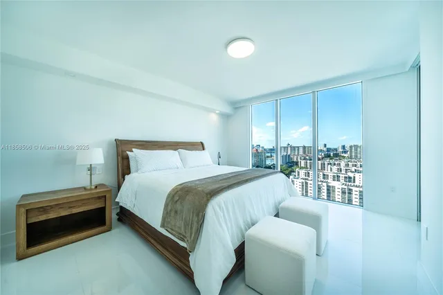 a bedroom with a bed and a couch