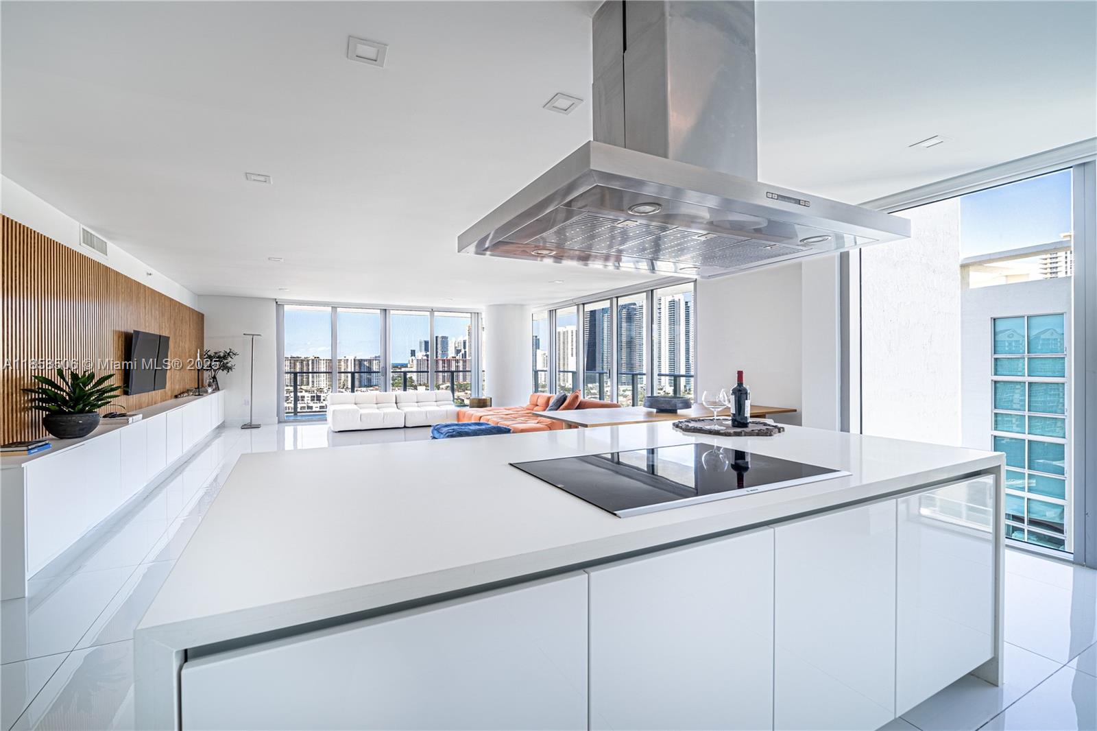 300 Sunny Isles Boulevard, Unit 41901 Sunny Isles Beach, FL 33160 - Photo 7 of 28 a kitchen with sink cabinets and window