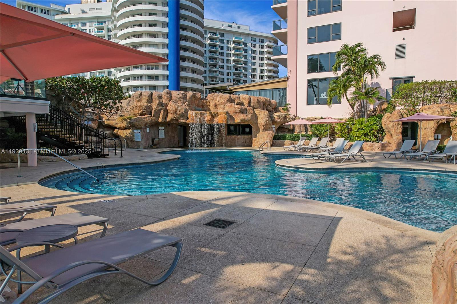 5225 Collins Avenue, Unit 1403 Miami Beach, FL 33140 - Photo 18 of 21 a view of swimming pool with outdoor seating and city view