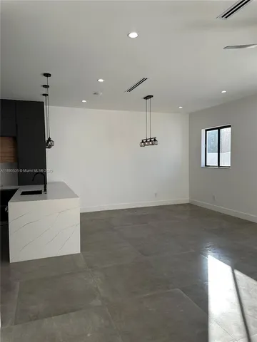 a bathroom with a sink and a shower