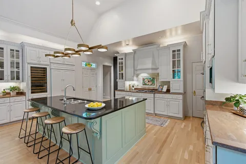 a kitchen with a table and chairs in it