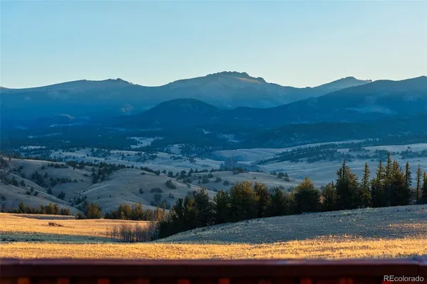 a view of city and mountain from a balcony