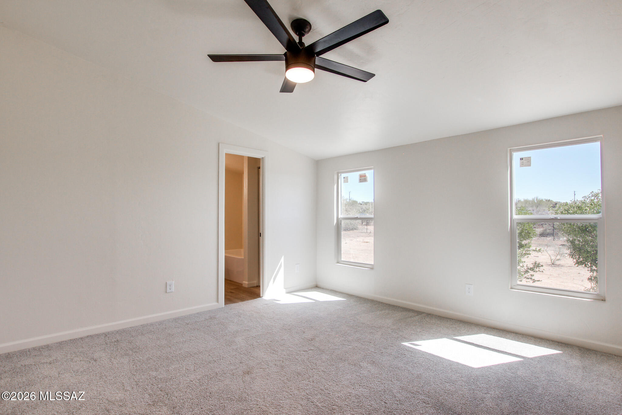 14303 West Rolina Lane Tucson, AZ 85736 - Photo 21 of 38 a view of a livingroom with a ceiling fan and window
