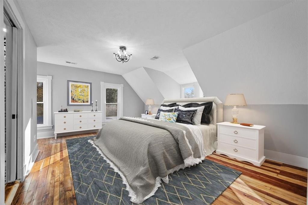151 Rockdale Road Butler, PA 16002 - Photo 17 of 25 a bedroom with a bed and a chandelier