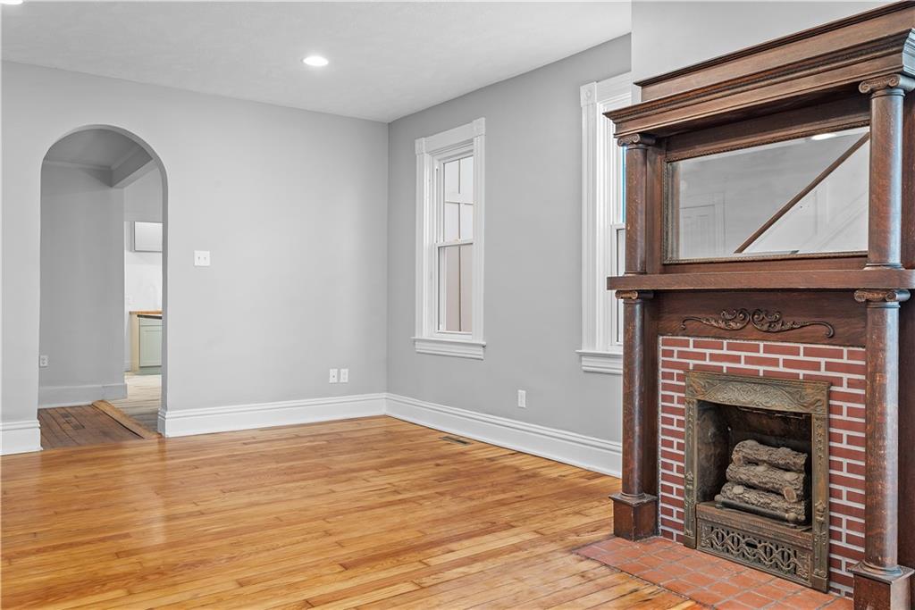 151 Rockdale Road Butler, PA 16002 - Photo 5 of 25 a living room with a fireplace in it