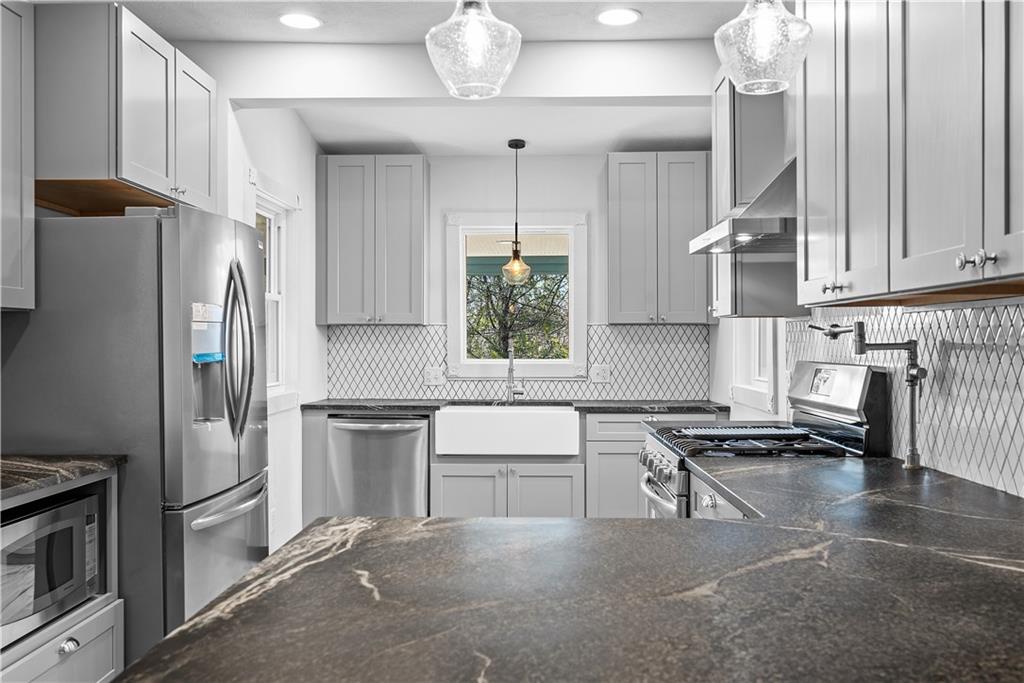 151 Rockdale Road Butler, PA 16002 - Photo 7 of 25 a kitchen with stainless steel appliances a stove a refrigerator and a sink