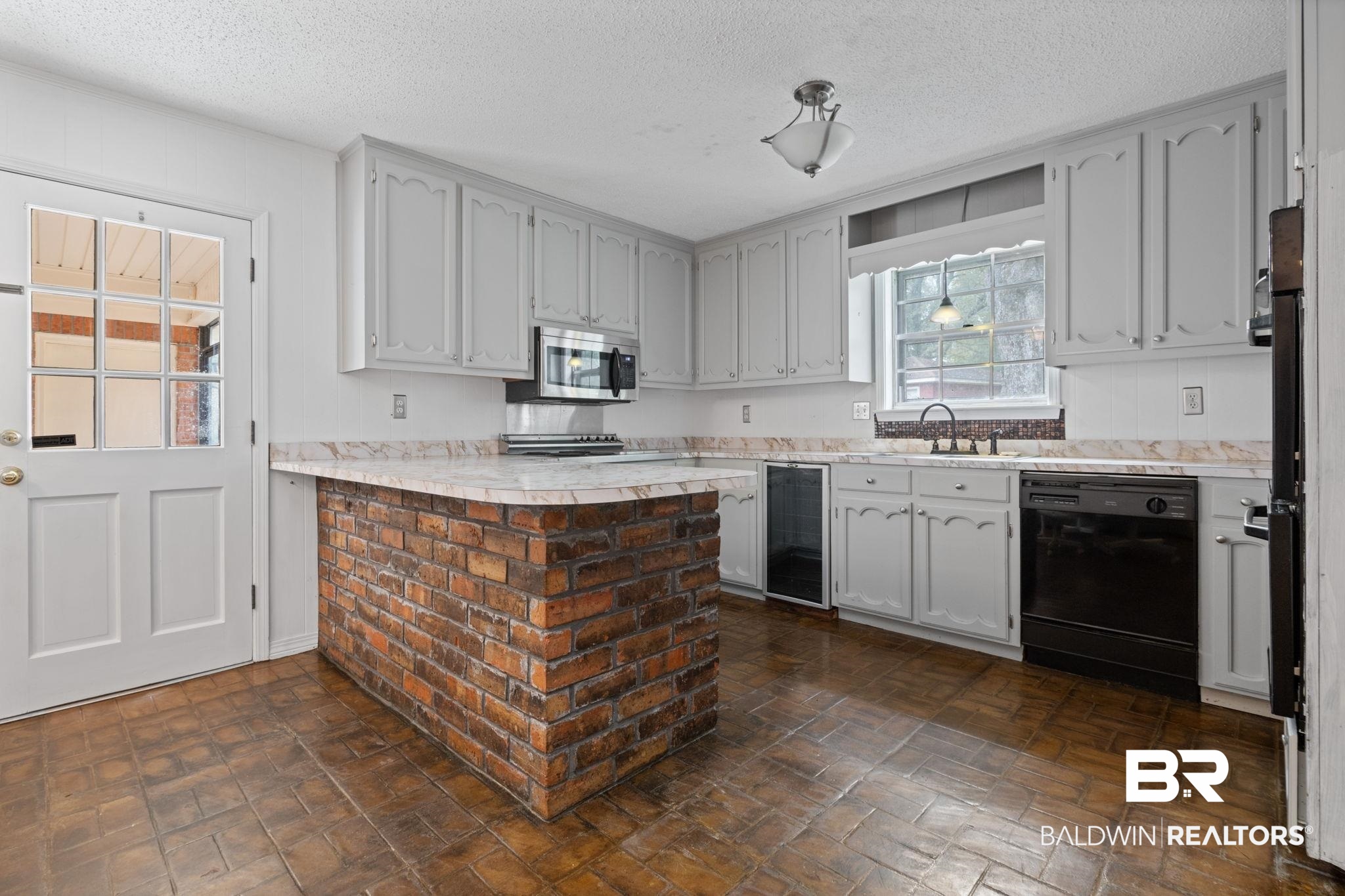 6261 Old Pascagoula Road Theodore, AL 36582 - Photo 17 of 29 Kitchen featuring dishwasher, sink, beverage cooler, and a textured ceiling