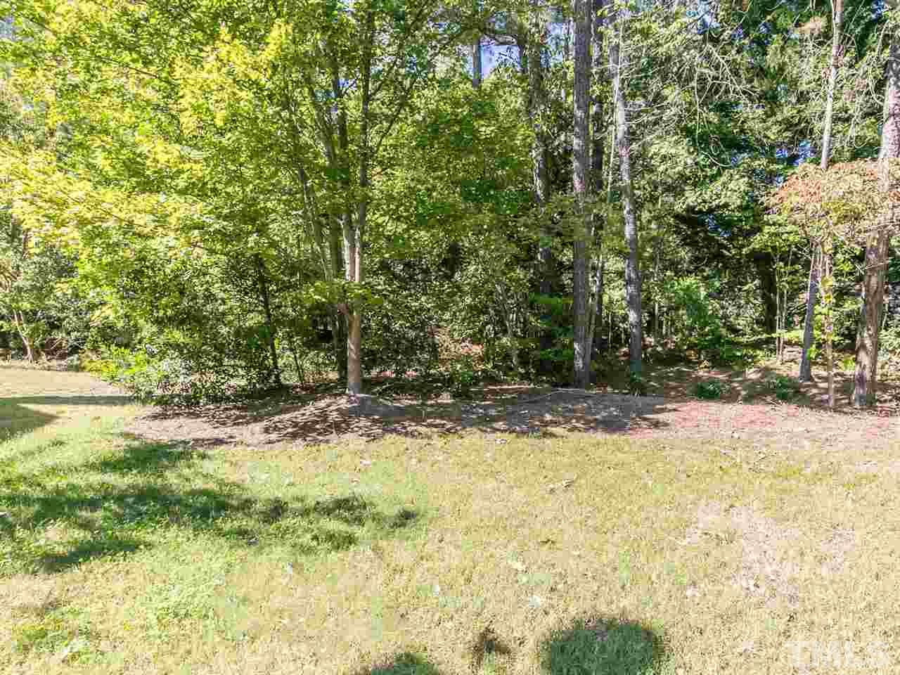 1312 Binley Place Raleigh, NC 27615 - Photo 22 of 22 a view of a yard with trees